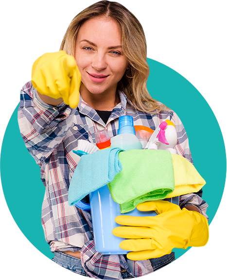 A woman holding cleaning supplies in her hands.